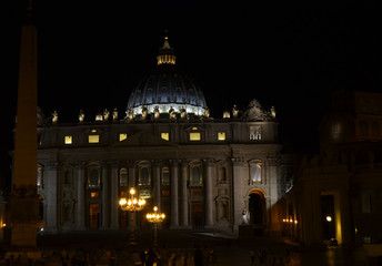 Fototapeta na wymiar Rome Italy . August 14, 2014 at 22:30. Night view of the Basilica of San Pietro, on the left the Vatican obelisk.