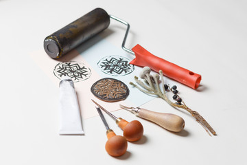 Greeting card on a dark wooden shabby background with old art tools. Top view