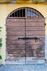 old wood door in the old city in Italy