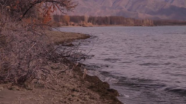 Lake Sevan waves on rocky beach
