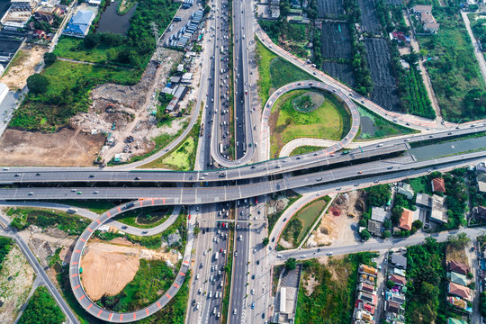 Traffic road junction view from above with green tree