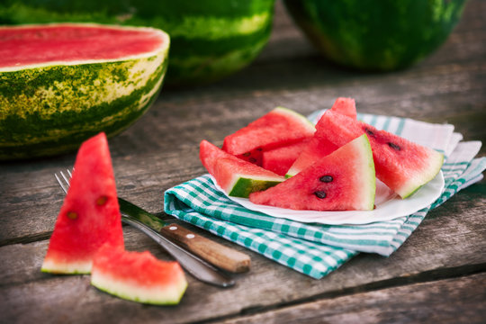 Watermelon cuts on table and plate