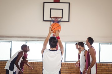 Basketball player about to take a penalty shot while playing