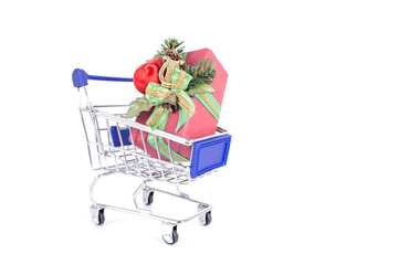 Shopping trolley with gift boxes decoration on a white background. Christmas and New Year sale