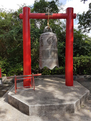 Bell. A metal bell with Chinese characters resembling the bells of the Ming dynasty.