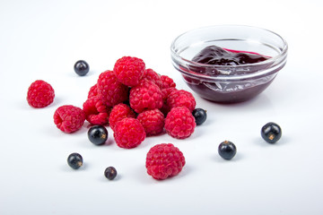 Homemade jam. Glass bowl with jam on a white background. Preserved berry. Top view. Berries