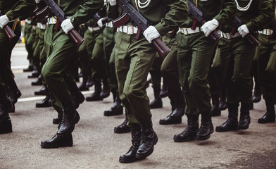 military men in green dress uniform marching to victory parade