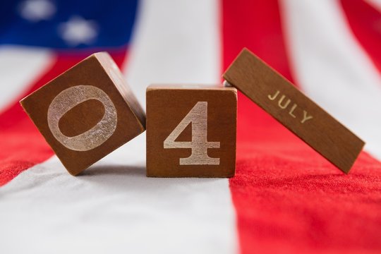 Date blocks on American flag with 4th July theme