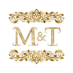 M and T vintage initials logo symbol. The letters are surrounded by ornamental elements. Wedding or business partners monogram in royal style.