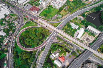 Intersection traffic circle road with car and green tree