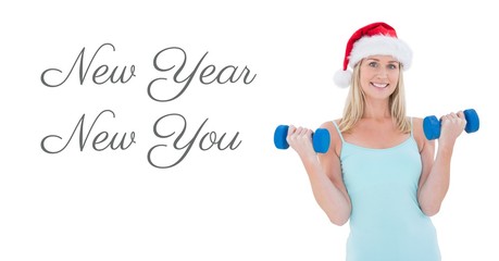New Year New You text and fit woman lifting weights in Santa hat