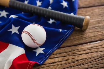 Baseball and bat on an American flag