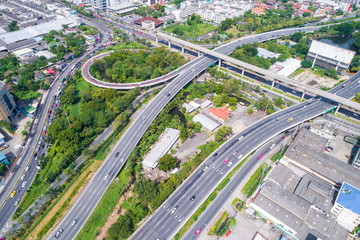Intersection traffic circle road with car and green tree