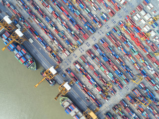 Obraz premium container,container ship in import export and business logistic,By crane,Trade Port , Shipping,cargo to harbor.Aerial view,Water transport,International,Shell Marine,transportation,logistic,trade,port