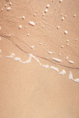 wave on sandy beach