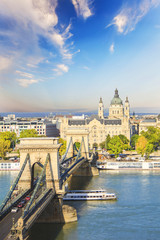 Beautiful view of the Basilica of Saint Istvan and the Szechenyi chain bridge across the Danube in Budapest, Hungary