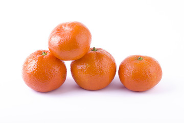 fresh mandarines isolated on white background. Oranges are arranged in rows. Placed on a white background..