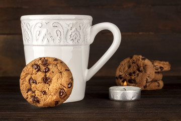Chocolate chips cookies, hot chocolate, candle, place for text