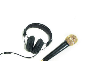 Modern headphone and Gold microphone isolated on white background