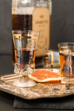 Amaretto almond liquor in silver shot glasses