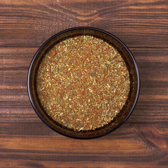 Spice mix - dill, parsley, basil, marjoram, oregano, savory, tomato, paprika, coriander, garlic, chili in a bowl