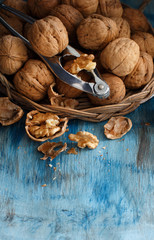Fresh walnuts on a blue wooden table