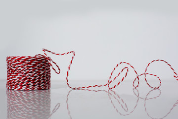 Red and white rope reel
