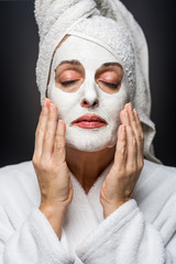 woman is white clay on his face mask