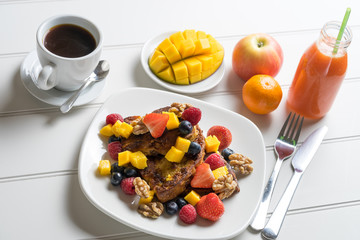 Fresh fruit french toast breakfast white table juice coffee luxury homemade cooked new year diet