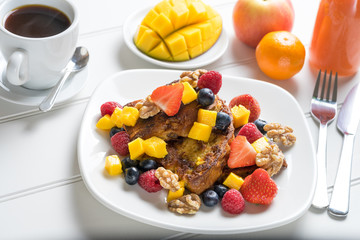 Fresh fruit french toast breakfast white table juice coffee luxury homemade cooked new year diet