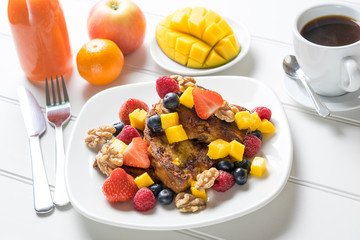 Fresh fruit french toast breakfast white table juice coffee luxury homemade cooked new year diet