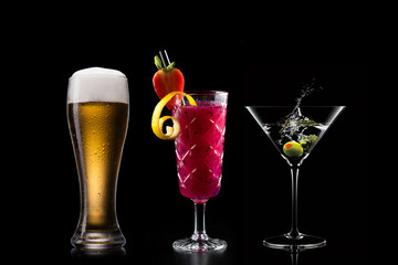 Selection of cocktails martini spritz bramble gin tonic beer bramble bar blurred black background
