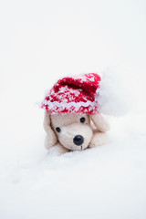 Small plush dog in Santa hat