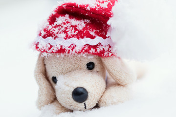 Small plush dog in Santa hat