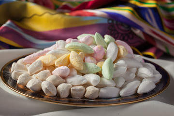 Oriental dessert.Parvarda-sweets made of flour and sugar on the dish.Uzbek sweets.