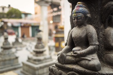Buddha statue in a middle of a temple in Kathmandu, Nepal