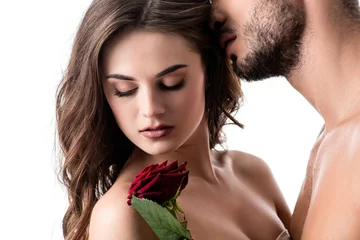 Fotobehang acctractive sensual couple with rose isolated on white © LIGHTFIELD STUDIOS