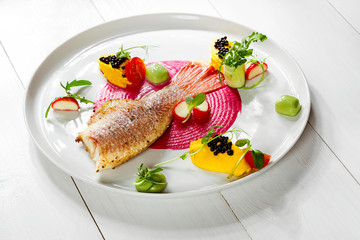 Fish dish - fried fish fillet and vegetables