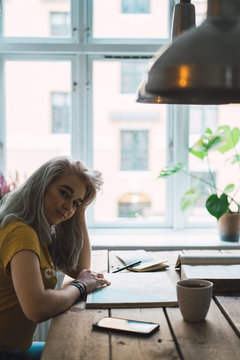 Woman with book at table