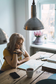 Woman with book at table