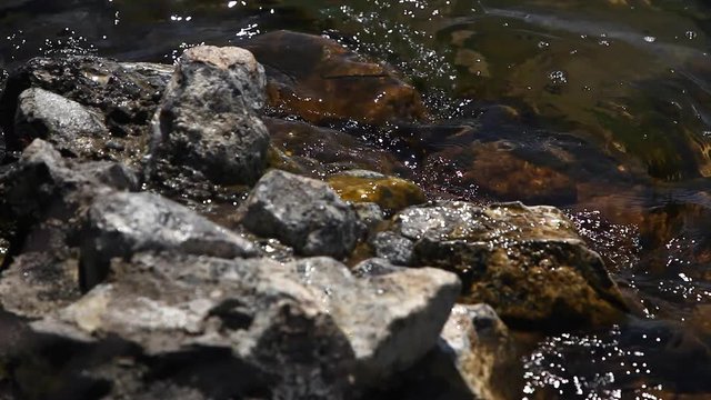 Lake Sevan waves on rocky beach