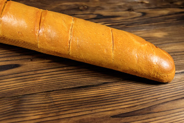 French baguette on wooden table