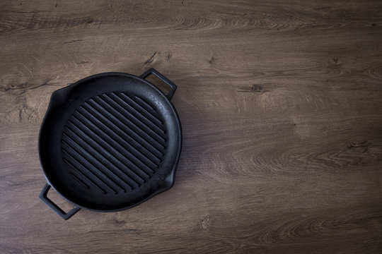 Empty Grill Pan On Wooden Table