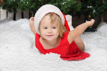 happy girl in santa costume on snow