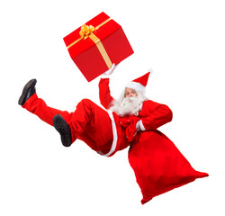 Funny Santa Claus falls with a bag full of x-mas gifts. Santa Claus rushing give gifts at Christmas. Falling Santa carry sack and gift box.