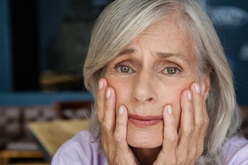 Portrait of worried senior woman