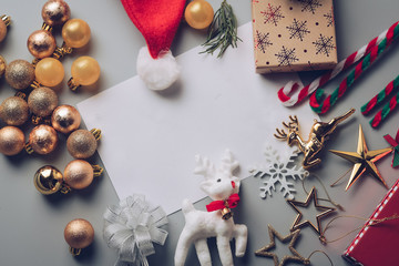 Christmas holiday background with gold ornaments and decorations. Merry christmas and happy new year greeting card with copy space. Christmas celebration holiday background.