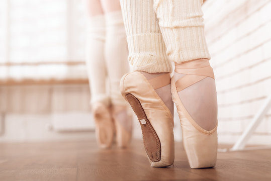 Legs of young ballerinas.