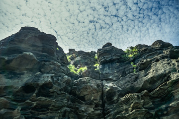 Fototapeta na wymiar Fantastic rock cliffs at jeju yongmeoli beach