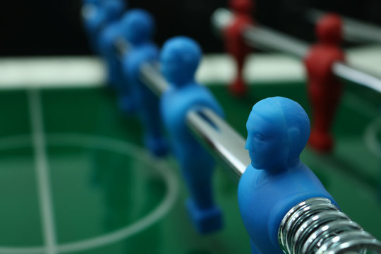 Table football game with red and blue players team